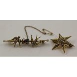 A 9CT GOLD BROOCH of star form, set with seed pearls about a central diamond, 3cm in diameter,