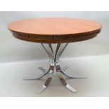 DYRLUND A 1960's FLIP FLAP EXTENDABLE TEAK TABLE on six point chromed base, 72cm high, 110cm