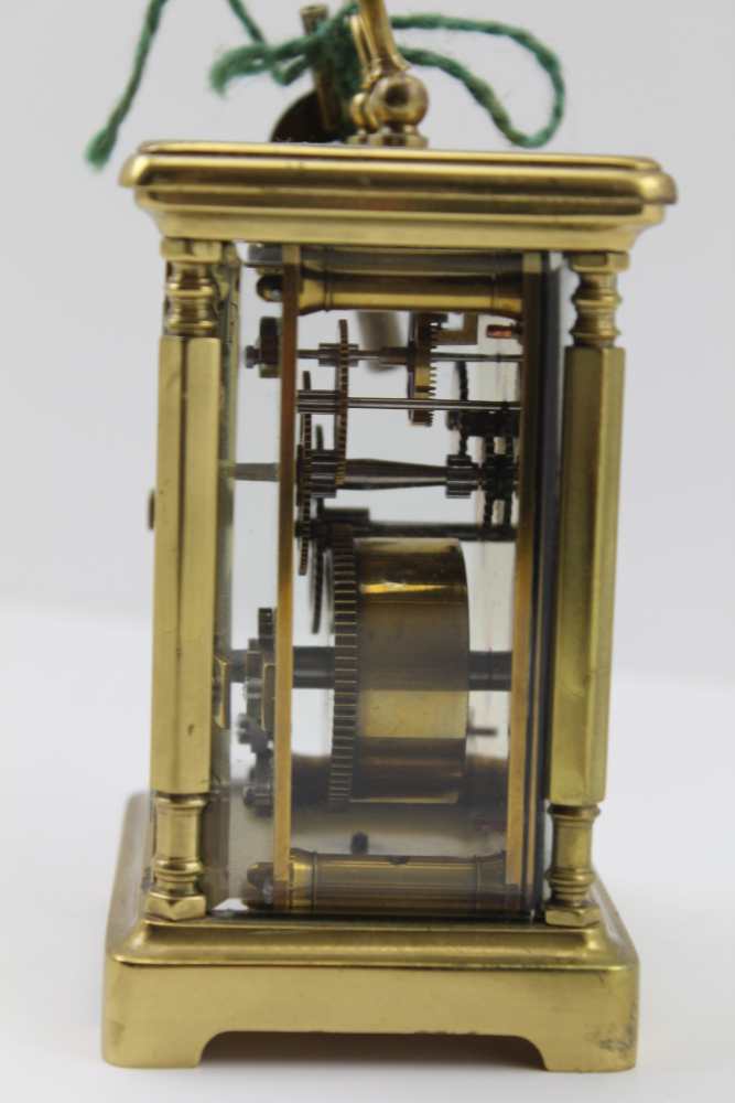 A BRASS FRAMED CARRIAGE CLOCK, with bevelled glass panels, white enamel dial with Roman numerals, - Image 3 of 3