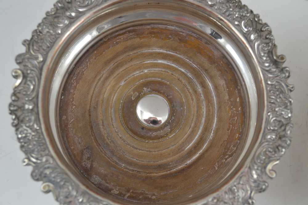 A PAIR OF SILVER PLATED BOTTLE COASTERS, Sheffield c1820, on turned wood bases, 16cm in diameter - Image 3 of 4