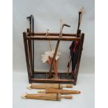 A COLLECTION OF WALKING STICKS & CHINESE PAPER PARASOLS, in a three section hall stand with two drip