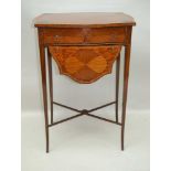 A 19TH CENTURY SHERATON STYLE MIXED WOOD WORK TABLE, having inset quarter veneered oval centre, with
