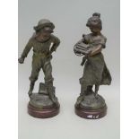 A PAIR OF LATE 19TH CENTURY PATINATED CAST METAL FIGURES of a young boy & a girl, by Auguste Moreau,