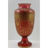 A LATE 19TH CENTURY CRANBERRY GLASS VASE with gilt key and leaf allover decoration, 12" high