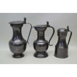 A TRIO OF PATINATED PEWTER LIDDED VESSELS, the tallest; 34cm