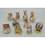 TEN BEATRIX POTTER POTTERY CHARACTER FIGURES by Royal Albert and Beswick (three with gold stamp),