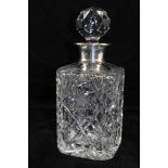 ROBERTS & DORE LTD A CUT GLASS DECANTER with silver mounts, London 1967, with faceted ball stopper