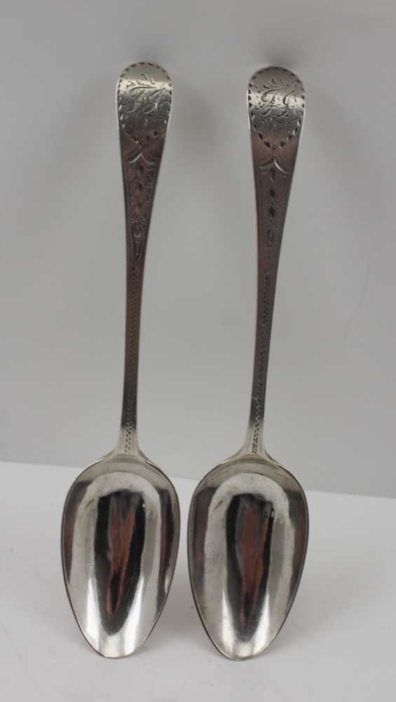 DUNCAN URQUHART & NAPHTALI HART A PAIR OF GEORGE III SERVING SPOONS, bright cut decoration, London