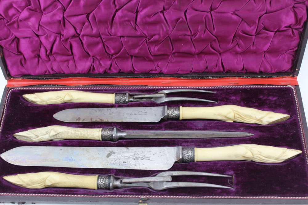 THOMAS TURNER OF SHEFFIELD A CASED MEAT & GAME CARVING SET, the handles carved bone to represent - Image 2 of 4