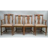 A SET OF EARLY 20TH CENTURY OAK FRAMED DINING CHAIRS, of Chippendale design, comprising; six singles