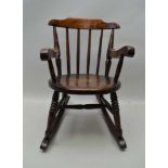 A FIRST-QUARTER 20TH CENTURY STICK BACK CHID SIZED PENNY SEATED ROCKING ARMCHAIR, 59cm high