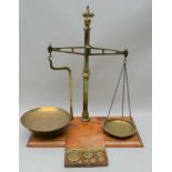 19TH CENTURY BRASS BEAM BALANCE SCALES "Class B to weigh 2lbs", on mahogany plinth base, together