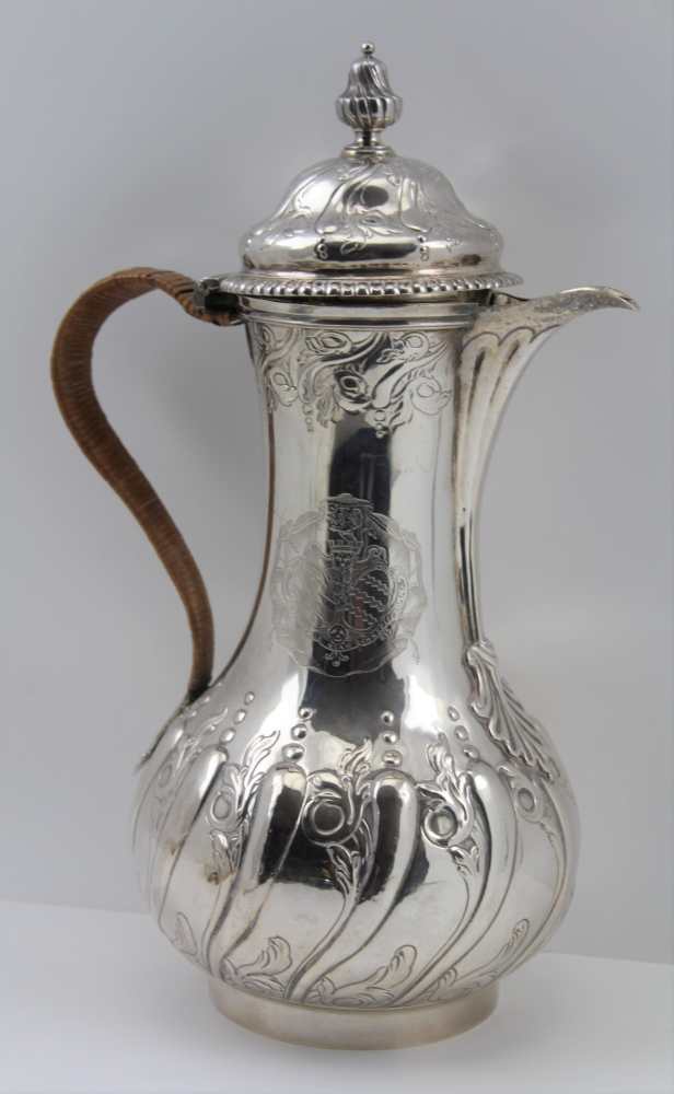 EMICK ROMER A GEORGE II SILVER JUG, London 1759, with chased and repousse decoration and fine