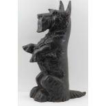 A CAST IRON SEATED "SCOTTIE DOG" DOORSTOP, 42cm high