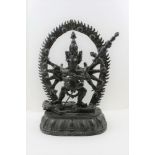 A MID 19TH CENTURY BRONZE TIBETAN YAB-YUM, a transcendental deity, having many arms, each hand