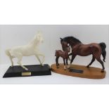 A BESWICK "SPIRIT OF AFFECTION" CERAMIC HORSE & FOAL FIGURE, mounted upon a polished mahogany