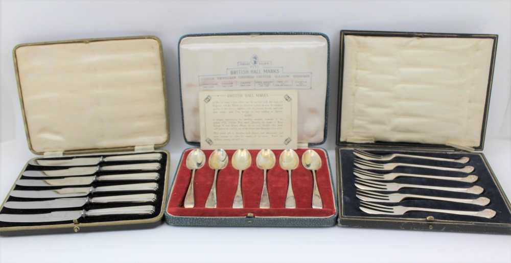 THREE CASED COLLECTIONS OF FLATWARE to include; a cased set of six silver spoons, British