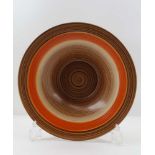 A WEDGWOOD HAND PAINTED SHALLOW MID-CENTURY BOWL, chocolate & orange swirl, raised on five lug feet,