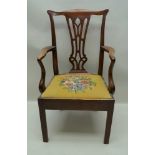 A19TH CENTURY MAHOGANY FINISHED HEPPLEWHITE DESIGN OPEN ARMCHAIR, with wool work drop-in seat pad,