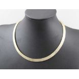 A 9CT GOLD NECKLACE of articulated braid form, 28g, in "Cupitt Jeweller of Bromsgrove" case