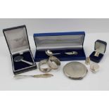 A COLLECTION OF DECORATIVE SILVER ITEMS to include; a cast floral handled ladle, cased, a silver