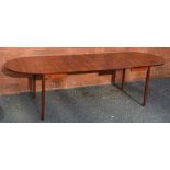 A MID TO LATE 20TH CENTURY "FINN JUHL" ROSEWOOD VENEER DINING TABLE of 'D' end design, raised on