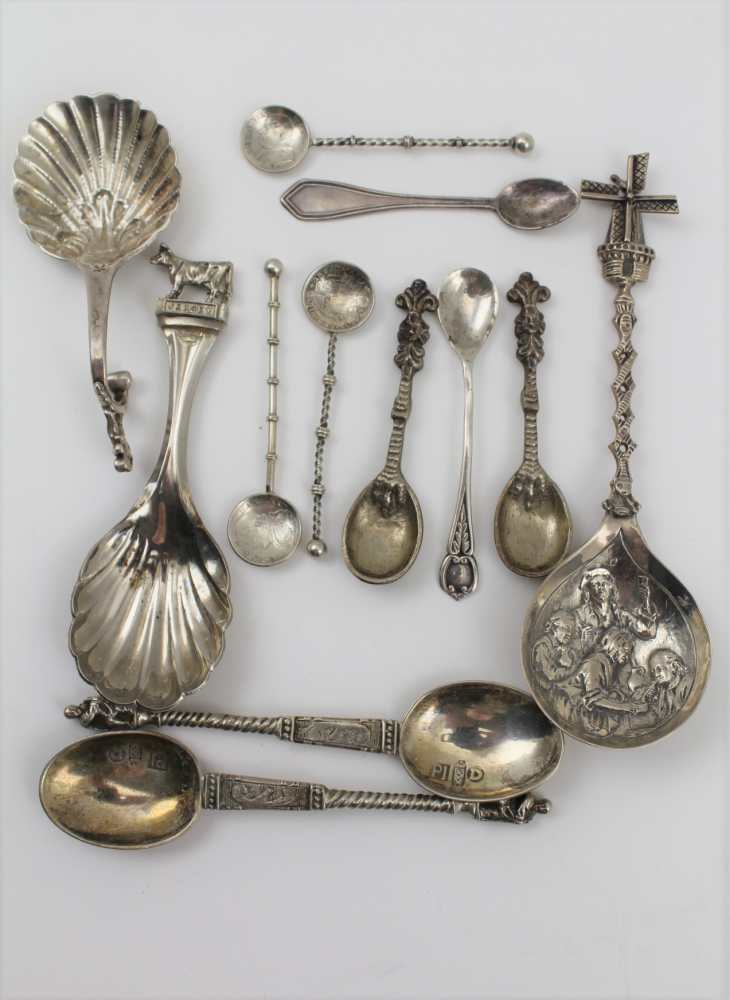 A SELECTION OF SILVER ITEMS to include a Dutch silver caddy spoon, a Windmill spoon with Dutch