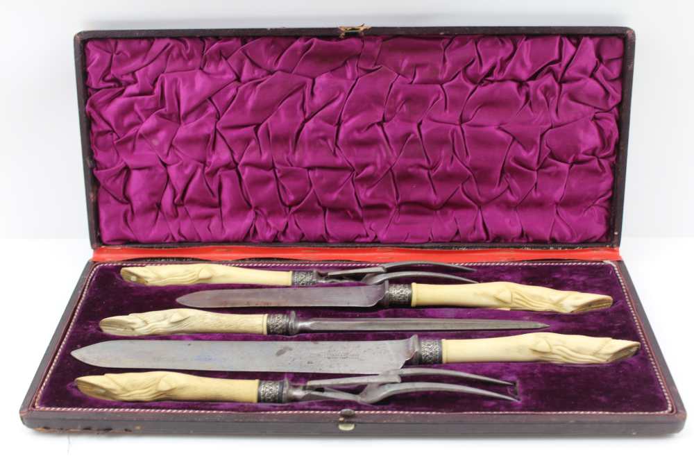 THOMAS TURNER OF SHEFFIELD A CASED MEAT & GAME CARVING SET, the handles carved bone to represent