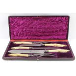 THOMAS TURNER OF SHEFFIELD A CASED MEAT & GAME CARVING SET, the handles carved bone to represent