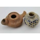 A ROMAN TERACOTTA OIL LAMP together with a small painted vase, 5cm high