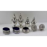 A COLLECTION OF SILVER CONDIMENTS comprising; a pair of oval sterling salts with blue glass