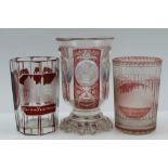 THREE 19TH CENTURY BOHEMIAN SPA GLASSES, each pink or ruby flashed and engraved with architectural