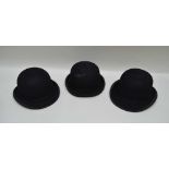 THREE BLACK BOWLER HATS; by Christy's, Moss Bros. and Austin Reed (1 hard top and 2 soft), sizes