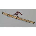 A JAPANESE SHORT SWORD (TANTO) with decoratively carved bone handle and scabbard, with brass mounts,