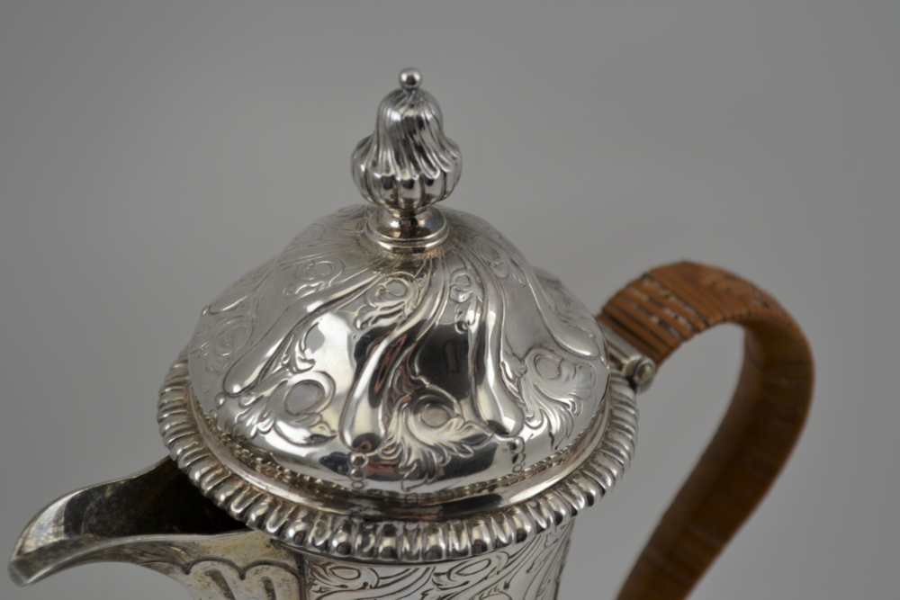 EMICK ROMER A GEORGE II SILVER JUG, London 1759, with chased and repousse decoration and fine - Image 2 of 5