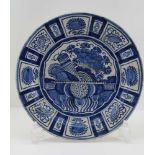 AN 18TH CENTURY DELFT TIN GLAZED EARTHWARE PLATE, handpainted cobalt blue decoration, 30cm diameter