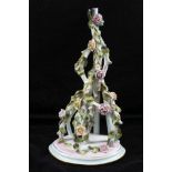 A GERMAN PORCELAIN HANGING WALL SHELF, floral encrusted, 31cm