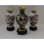 A PAIR OF CHINESE CLOISONNE VASES, pink blossoms on a white ground, 15.5cm high (with carved wood