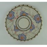 A CROWN DUCAL CHARLOTTE RHEAD POTTERY WALL CHARGER, piped and hand painted floral decoration, with