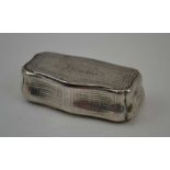A 19TH CENTURY FRENCH WHITE METAL SNUFF BOX, of serpentine bombe form, chased decoration, hinged