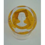 A BACCARAT FACET GLASS PAPERWEIGHT, amber base inset sulphide portrait of HM Queen Elizabeth II,