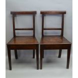 A PAIR OF 19TH CENTURY OAK SINGLE CHAIRS, bar backs, plank seats on square tapering supports