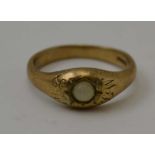 A 9CT GOLD GYPSY RING inset cabochon, total weight; 4.8g