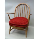 A BEECH FRAMED MID-CENTURY STICK BACK OPEN ARMCHAIR