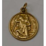 A 9CT GOLD ST. CHRISTOPHER PENDANT, of circular form with suspension ring, 1.8g