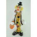 A MURANO GLASS CLOWN, holding a bottle in his right hand, 22cm high