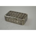 A RUSSIAN SILVER SNUFF BOX, all over engraved Niello work, of stylised flowerheads, bears stamp