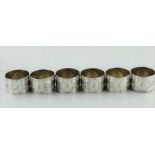 A SET OF SIX WMF SILVER PLATED NAPKIN RINGS, Art Nouveau decoration, bearing WMF Austerlich mark, c.