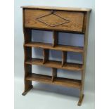 AN EDWARDIAN OAK BOOK SHELF UNIT with fold down top section, 64cm wide x 92cm high