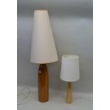 TWO POLISHED WOOD TABLE LAMPS of mid-century design, both with shades, the tallest;117cm high (to